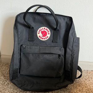 Fjall Raven Kanken book bag.